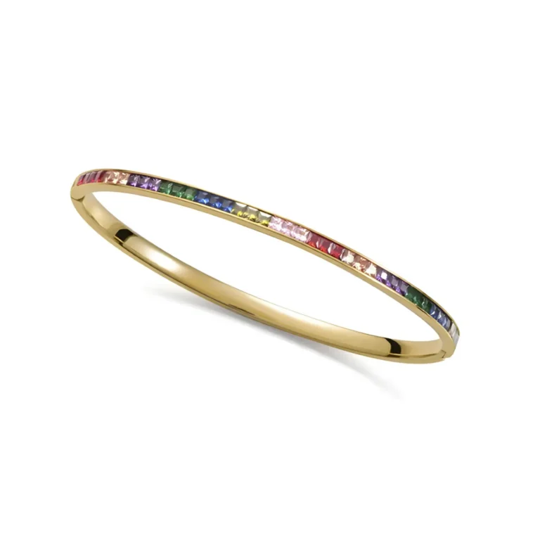 Gold bangle featuring a colorful array of square-cut gemstones on one side, showcasing a vibrant and elegant design.