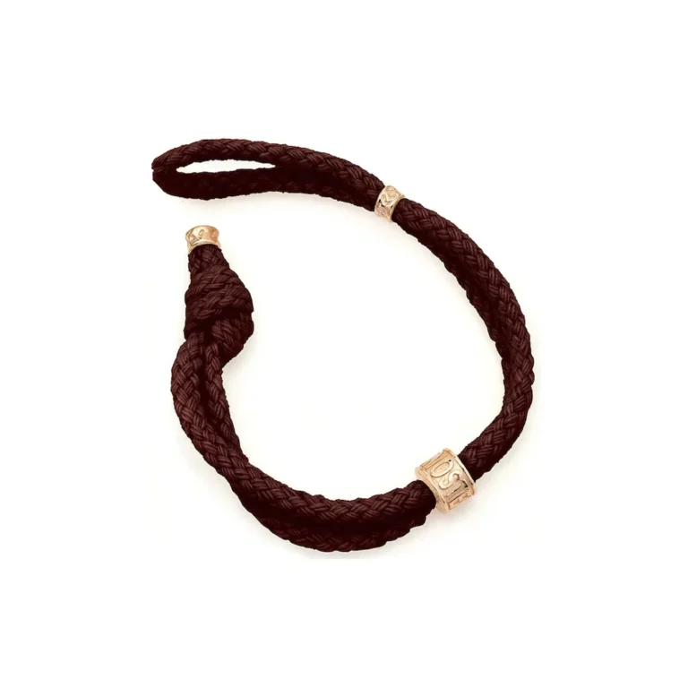 Braided dark brown bracelet embellished with decorative gold beads, showcasing a stylish and unique design.