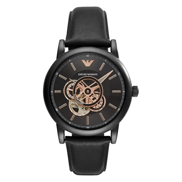 Black Emporio Armani watch with a transparent dial, showcasing intricate gears and rose gold accents, set on a leather strap.