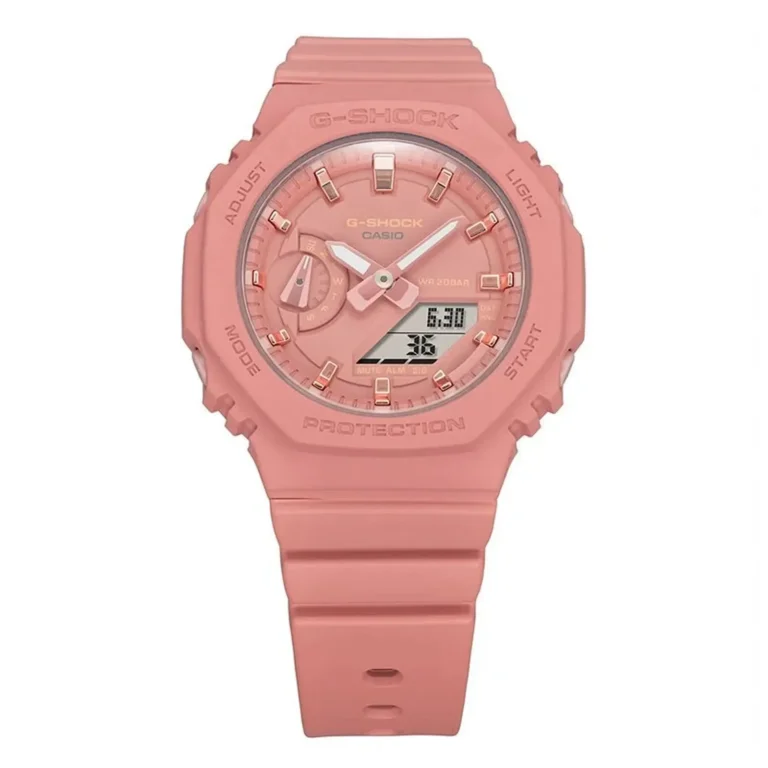Close-up of a pink Casio G-Shock watch featuring a digital display, analog hands, and a sturdy rubber strap.
