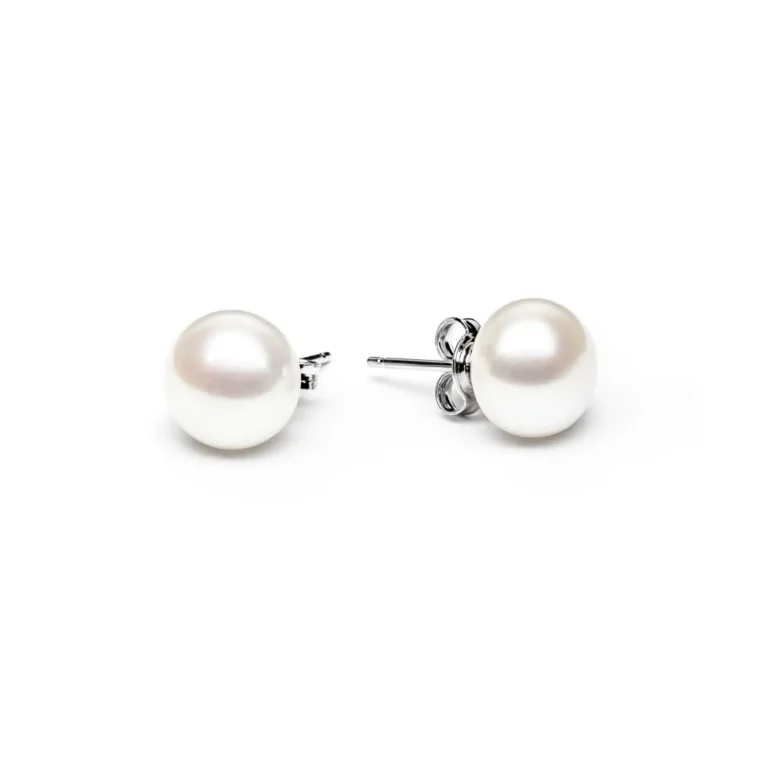 Elegant white pearl stud earrings with silver posts, showcasing a classic and timeless design against a simple white background