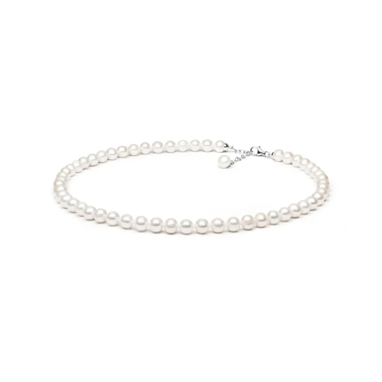 A classic pearl necklace featuring lustrous white pearls and a silver clasp, elegantly displayed on a white background.