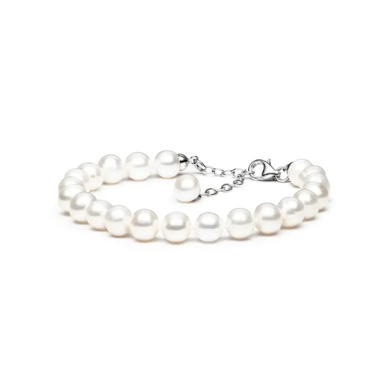 A delicate pearl bracelet with a silver clasp and adjustable chain, featuring luminous white pearls arranged neatly in a single strand.