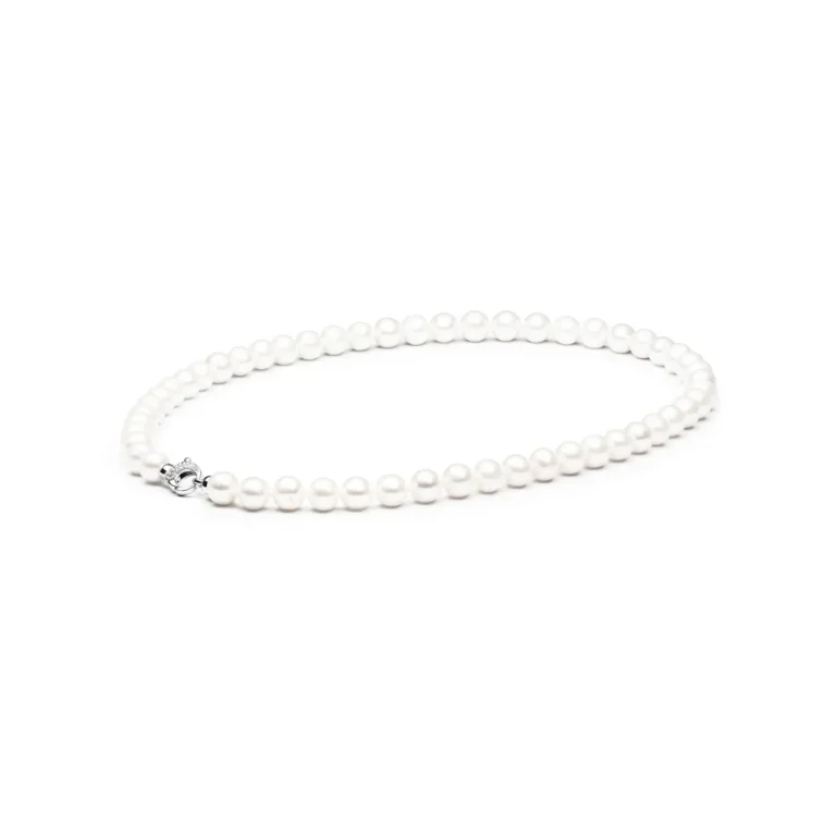 Elegant strand of lustrous white pearls with a silver clasp, showcasing classic sophistication and timeless beauty.