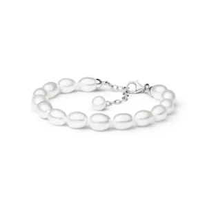 A delicate pearl bracelet featuring a clasp with an adjustable extension chain, showcasing lustrous white, oval-shaped pearls.