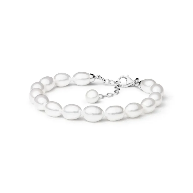 A delicate pearl bracelet featuring a clasp with an adjustable extension chain, showcasing lustrous white, oval-shaped pearls.