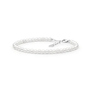 Elegant white pearl bracelet with a silver clasp and adjustable chain, showcasing a classic and timeless design.