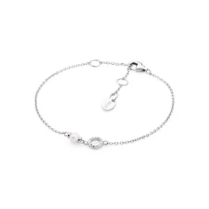 Silver bracelet featuring a pearl and a circular charm adorned with sparkling stones, completed with a clasp and adjustable chain.