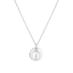 Silver necklace featuring a circular pendant with a lustrous oval white pearl at the center, showcasing elegant simplicity.