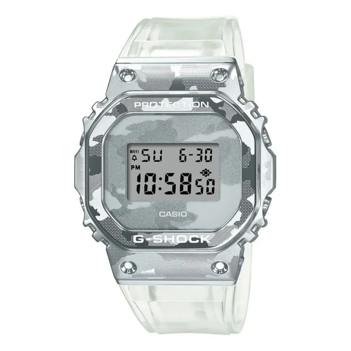 GM-5600SCM Casio G-Shock watch with a silver camouflage pattern, digital display, and clear strap, showing time 10:58 PM on a sunny day.