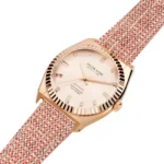 Rose gold watch with a sparkling blush face and a textured red-patterned strap, showcasing a stylish, modern design by Jason Hyde.