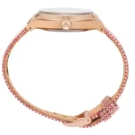 Side view of a stylish wristwatch with a gold case and a colorful woven strap in shades of pink, featuring a decorative buckle.