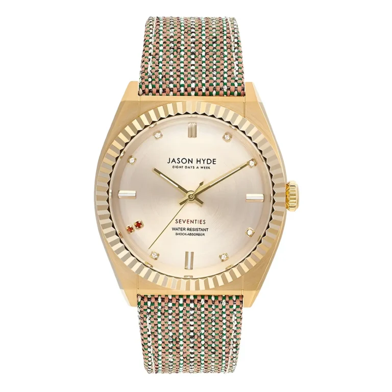 Gold-tone Jason Hyde watch with a textured woven strap, featuring a metallic dial and diamond markers, labeled "Seventies."