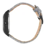 Side view of a stylish watch featuring a black case and a unique checkered fabric strap, showcasing craftsmanship and modern design.