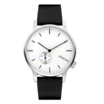 KOMONO TRW3002 Hopeinen Komono kello, jossa musta ranneke, minimalistinen muotoilu ja pieni apukellotaulu sekunneille.