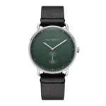 Green dial watch by Paul Hewitt with silver hands and a black leather strap, featuring a subtle anchor symbol at the 6 o'clock position.