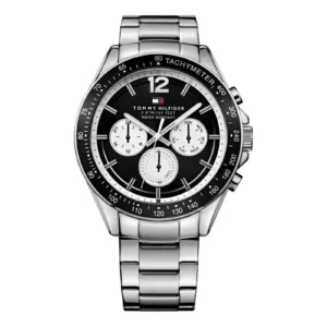 Stylish Tommy Hilfiger stainless steel watch with a black dial, three sub-dials, and tachymeter, featuring a silver metal bracelet.