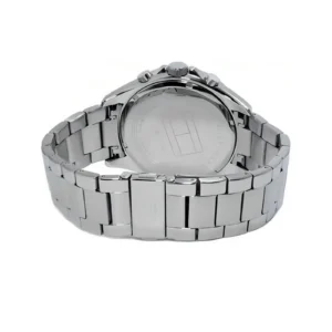 Close-up of a sleek silver stainless steel watch with a polished bracelet and visible brand markings on the back.