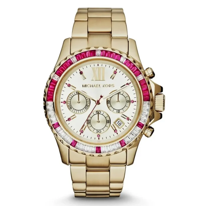 Gold Michael Kors watch with a pink and white jeweled bezel, white face, three sub-dials, and a date display. Elegant and stylish design.
