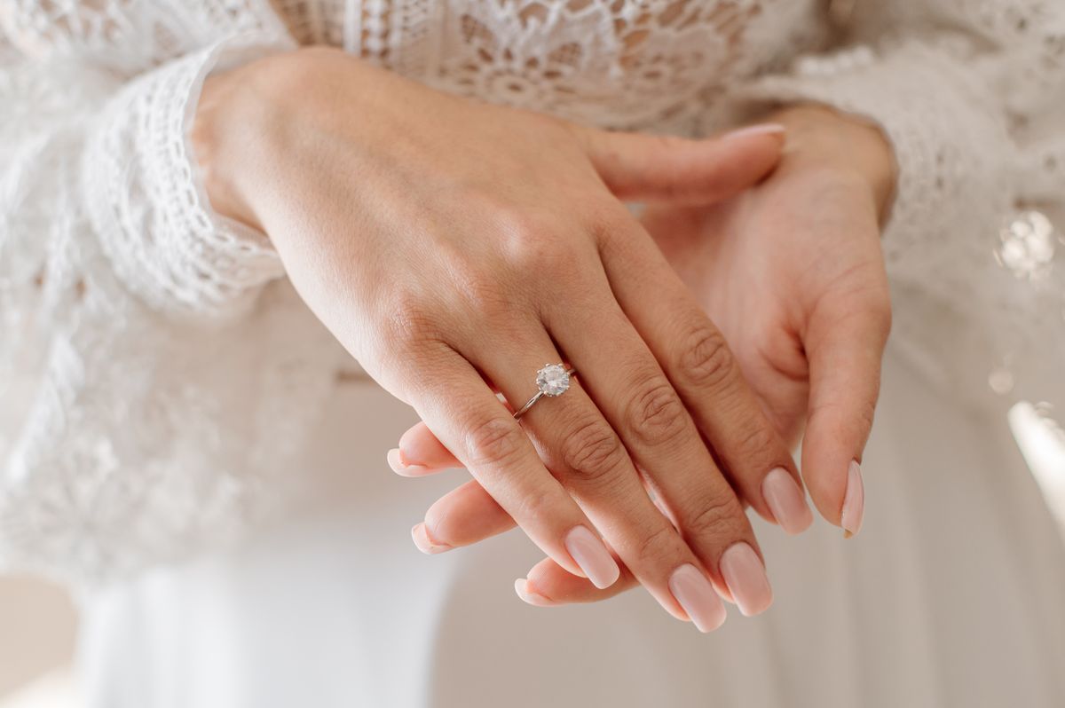 Bride with engagement ring on her finger