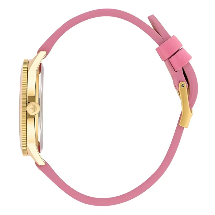 Side view of a gold-tone wristwatch with a round face and a pink leather strap, featuring a crown and buckle closure.