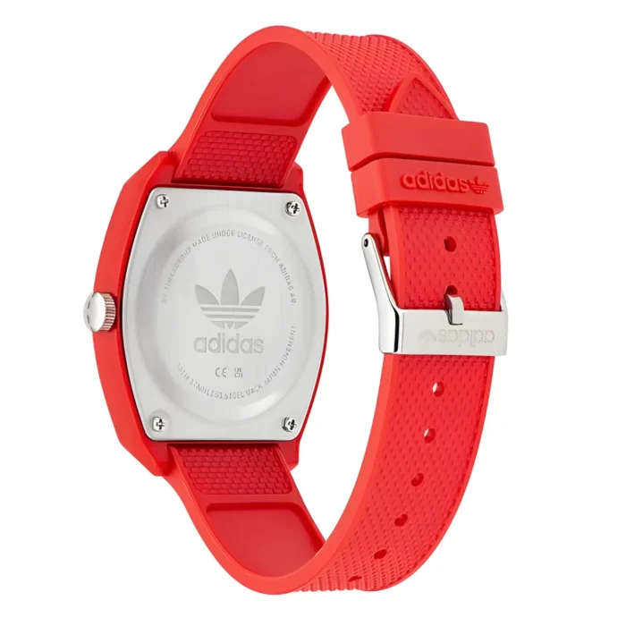 Red Adidas watch featuring a sleek design, rubber strap, and metallic backside with the Adidas logo. Stylish and sporty accessory.
