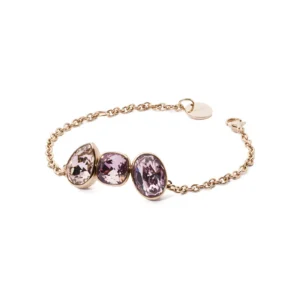 A delicate gold chain bracelet featuring three oval, purple gemstones, elegantly showcasing their sparkling facets.