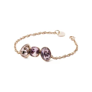 A delicate gold chain bracelet featuring three oval, purple gemstones, elegantly showcasing their sparkling facets.