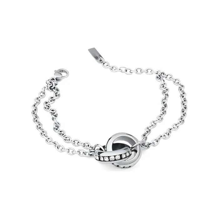 Silver bracelet featuring intertwined loops and a sparkling band of gems, showcasing elegance and modern design.