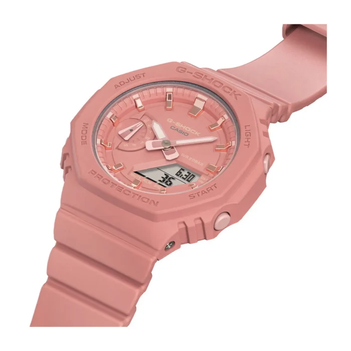 Close-up of a pink Casio G-Shock watch featuring an analog-digital display, durable rubber strap, and multiple function buttons.