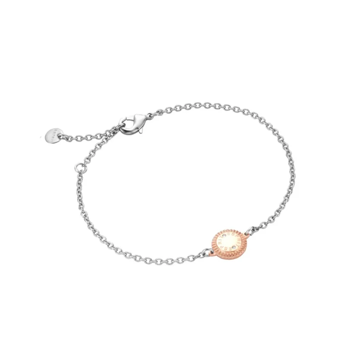 A delicate silver bracelet featuring a rose gold circular charm with engraved details, secured with a lobster clasp.