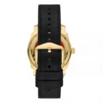 Black leather watch strap with a gold buckle and Fossil branding, showcasing the back of a stylish timepiece.