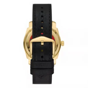 Black leather watch strap with a gold buckle and Fossil branding, showcasing the back of a stylish timepiece.