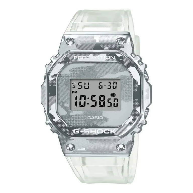 Casio G-Shock watch with a silver camouflage pattern, digital display, and clear strap, showing time 10:58 PM on a sunny day.