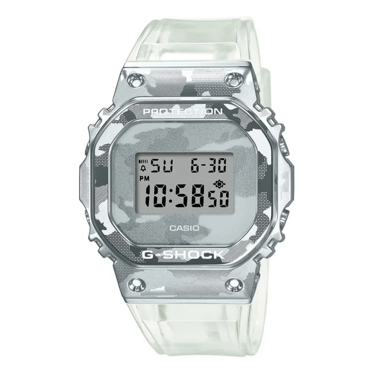 Casio G-Shock watch with a silver camouflage pattern, digital display, and clear strap, showing time 10:58 PM on a sunny day.