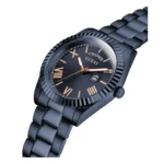 Black Guess watch featuring a Roman numeral dial, gold accents, date display, and sleek metal bracelet.