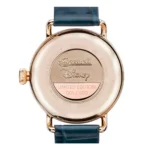 The back of a limited edition Ingersoll Disney watch, showcasing "001/500" engraving and a gold-tone finish with a blue leather strap.