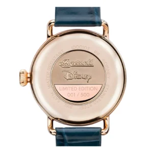 The back of a limited edition Ingersoll Disney watch, showcasing "001/500" engraving and a gold-tone finish with a blue leather strap.