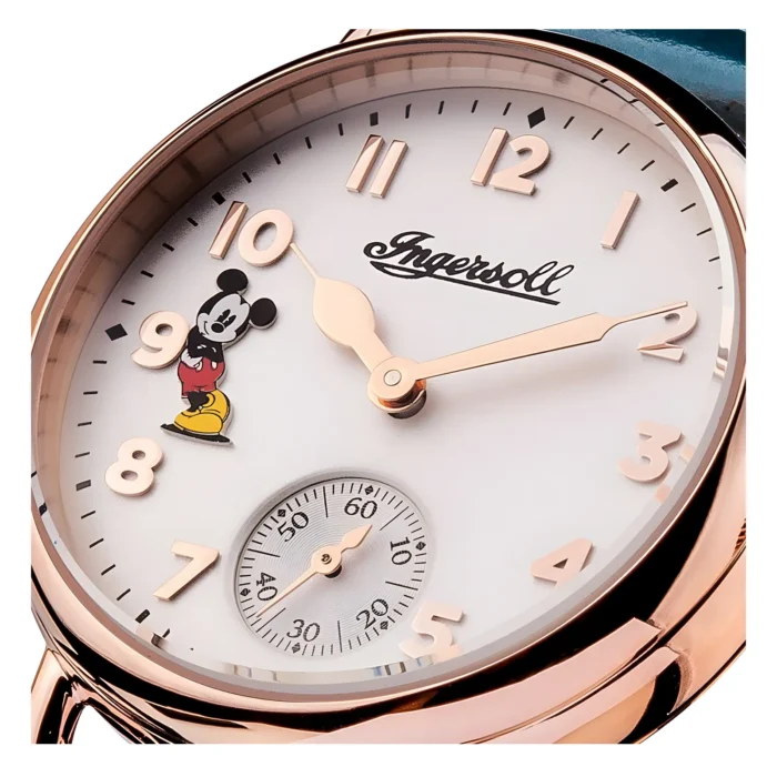 Close-up of an Ingersoll watch featuring a white dial, rose gold numbers, and a cheerful Mickey Mouse figure near 9 o'clock.