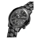 A sleek, black Guess watch featuring a glossy dial, chronograph functionality, and a stylish metallic bracelet. Stylish timepiece detail.