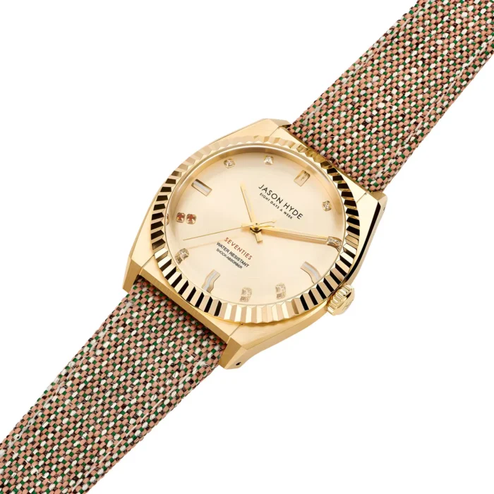 Gold Jason Hyde watch with a beige dial, diamond markers, and a textured multicolored strap, showcasing a stylish and modern design.