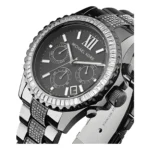 Close-up of a black Michael Kors watch featuring a studded bezel, three sub-dials, and a sleek stainless steel band.