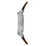 Side view of a sleek silver watch with a brown leather strap and a prominent Swiss cross logo on the crown.