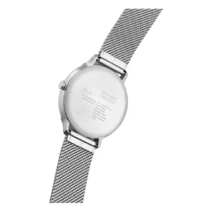 Back view of a Mondaine Helvetica watch showcasing a stainless steel case and mesh strap, with engraved brand and manufacturing details.