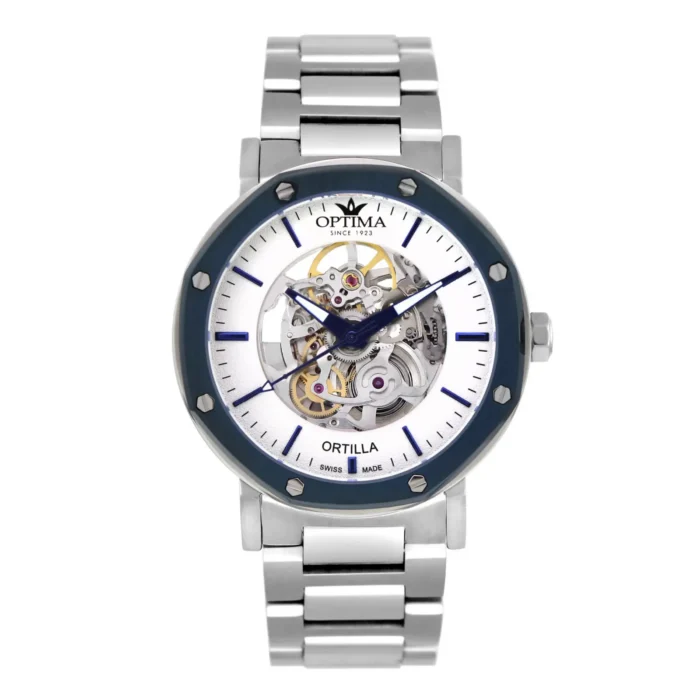 A sleek silver watch with a skeleton design, featuring a blue bezel and silver link strap. The dial showcases intricate gears and hands.