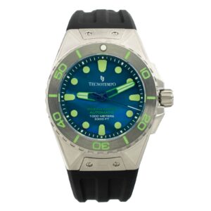 Close-up of a TecnTempo Ocean Force automatic watch with a blue dial, luminous markers, and a black rubber strap. Water resistant to 1000 meters.