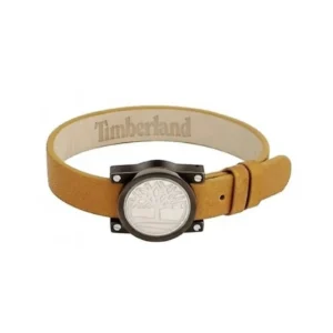 A stylish Timberland leather bracelet featuring a circular silver emblem with a tree logo and a tan strap.