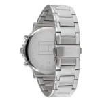 Close-up of a stainless steel Tommy Hilfiger watch with a sleek, modern design and a polished bracelet, displaying the brand logo on the back.