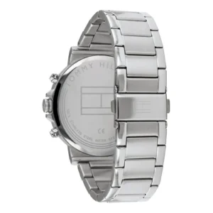 Close-up of a stainless steel Tommy Hilfiger watch with a sleek, modern design and a polished bracelet, displaying the brand logo on the back.