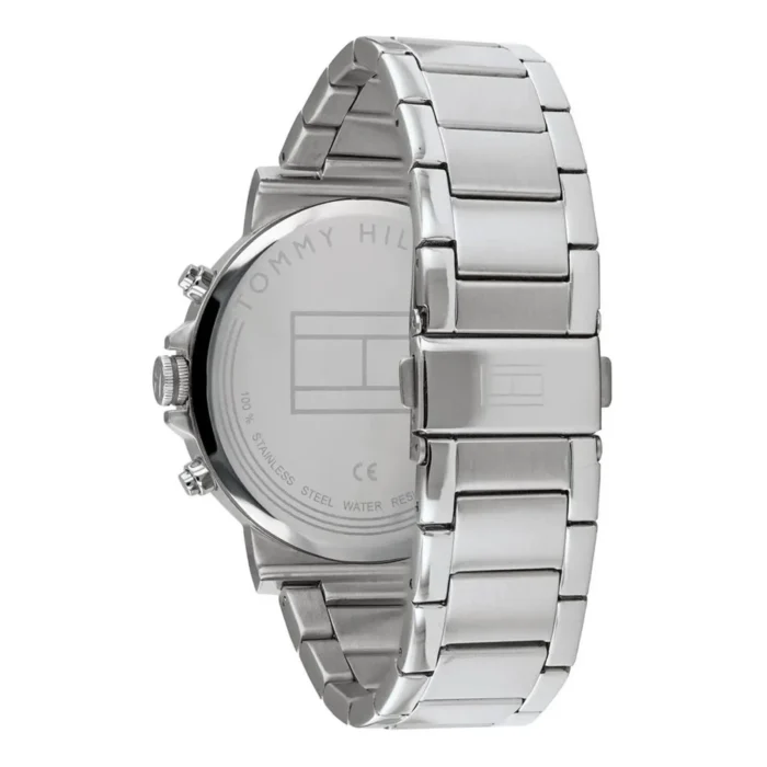 Close-up of a stainless steel Tommy Hilfiger watch with a sleek, modern design and a polished bracelet, displaying the brand logo on the back.